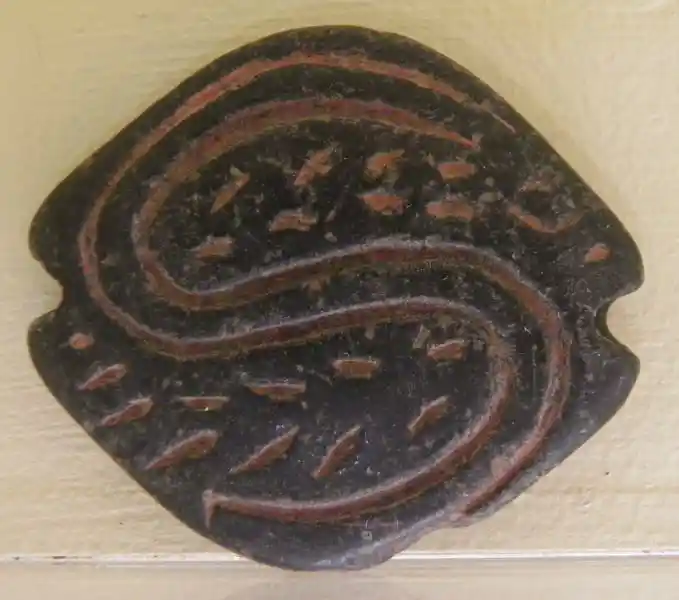Hermatite and faience seals, snake-like symbol